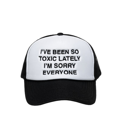 We're Not Really Strangers Black I've Been So Toxic Lately Trucker Hat reading "I've Been So Toxic Lately I'm Sorry Everyone" in black embroidery on the front white panel of hat.