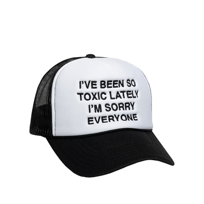 We're Not Really Strangers Black I've Been So Toxic Lately Trucker Hat reading "I've Been So Toxic Lately I'm Sorry Everyone" in black embroidery on the front white panel of hat.