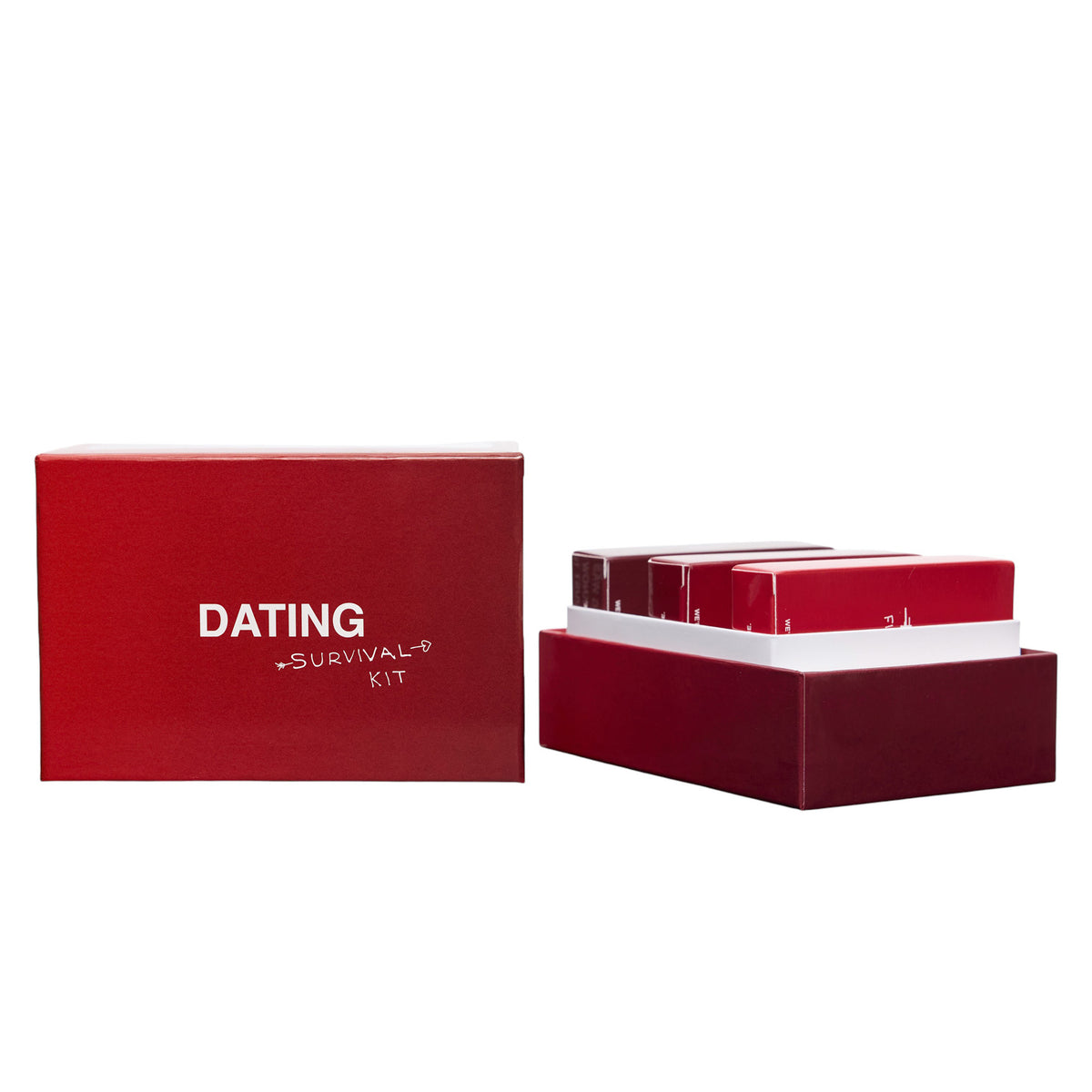 Red boxed dating survival kit with outer sleeve and stacked card decks inside.