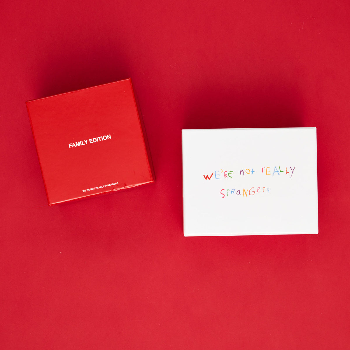 Red box labeled "Family Edition" and white card with handwritten text on red background.