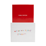 Red and white box set with "Family Edition" text on red lid and colorful handwritten text reading "We're not really strangers