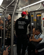 Black hoodie with white text reading "Stop trying to be liked by everybody you don't even like everybody" on back.