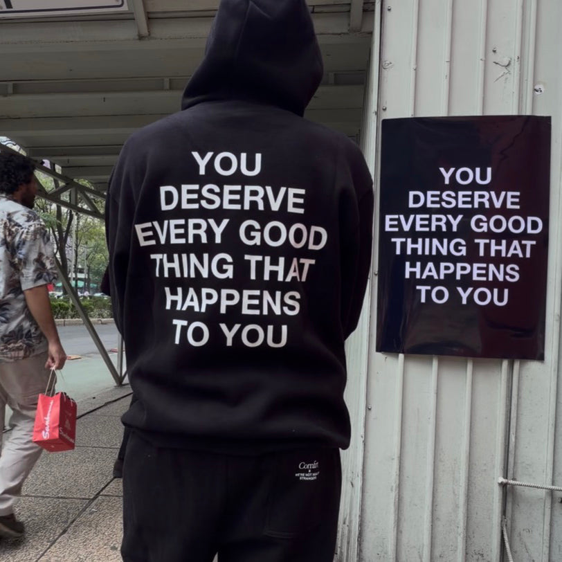 Black hoodie and sweatpants set with white text reading "You deserve every good thing that happens to you" on back.