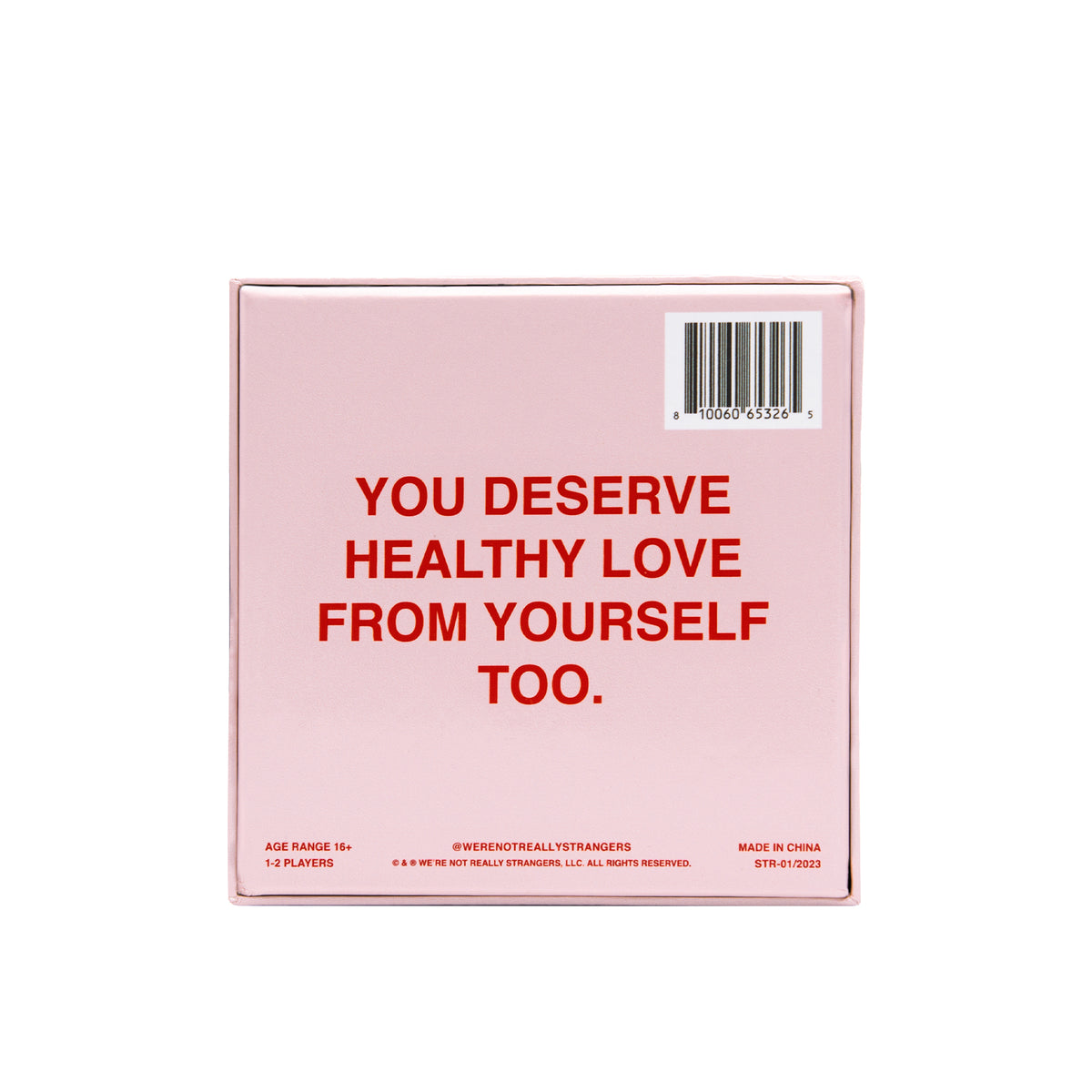 Pink board game box with red text reading "You deserve healthy love from yourself too" and barcode label.