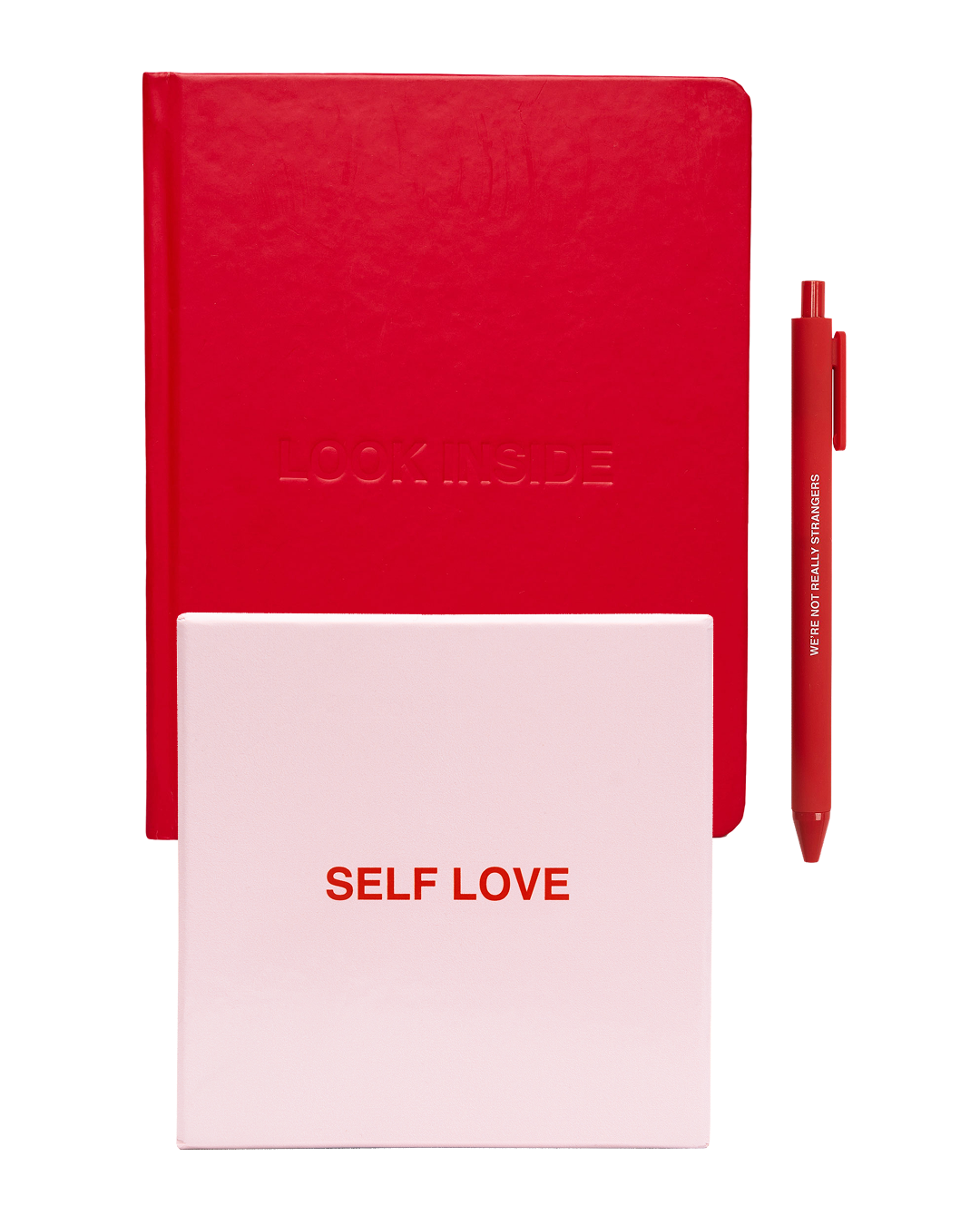 A red hardcover journal embossed "Look Inside" sits beside a red pen and a pink "Self Love" box.