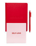 A red hardcover journal embossed "Look Inside" sits beside a red pen and a pink "Self Love" box.