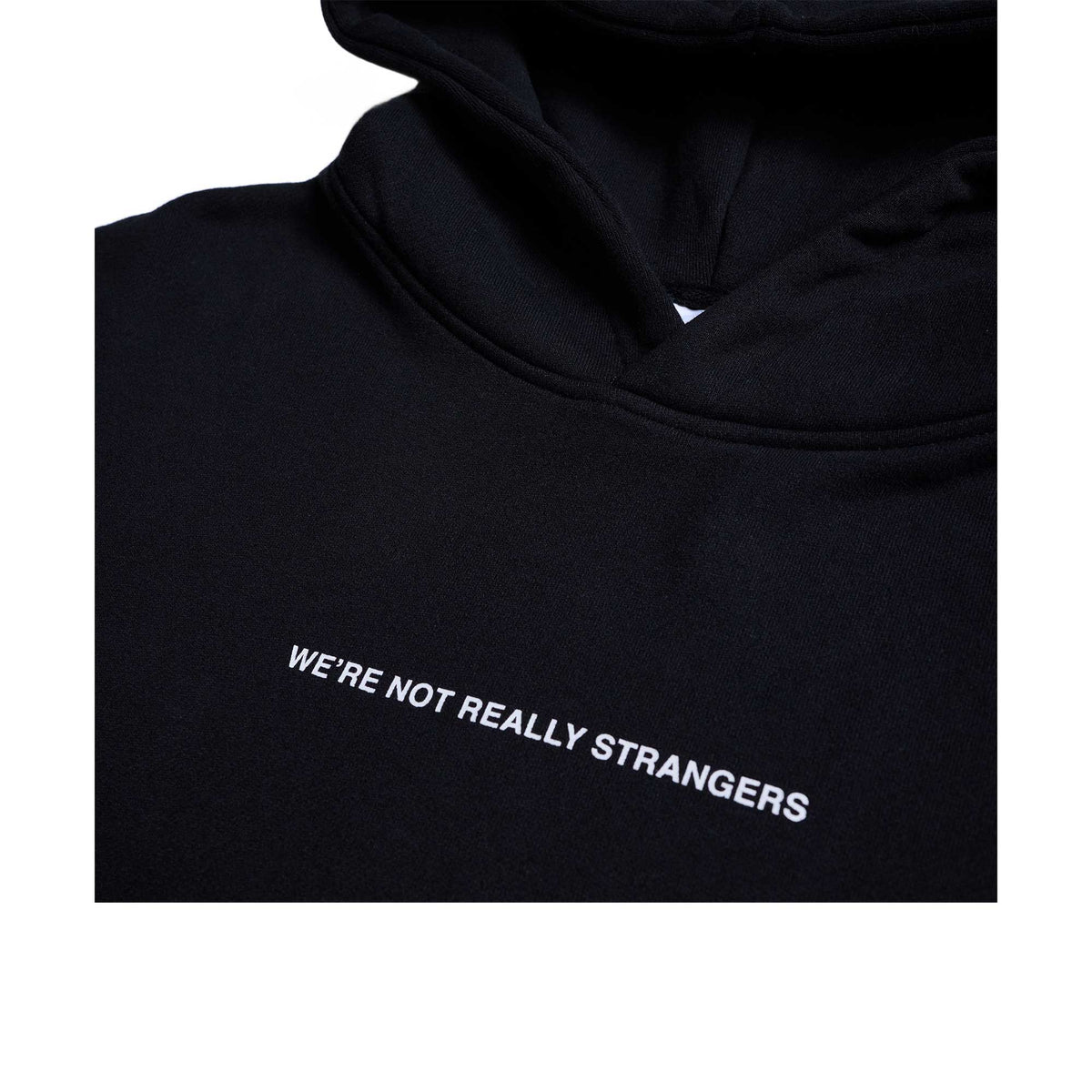 Black hoodie with white text reading "WE'RE NOT REALLY STRANGERS" on the chest and drawstring hood.