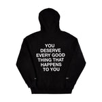 Black pullover hoodie with white text reading "You deserve every good thing that happens to you" on back.