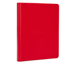 Red hardcover journal with embossed text on front cover and rounded corners.