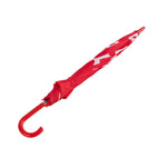 Red umbrella with white geometric pattern and curved red handle.