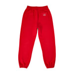 Red sweatpants with elastic waistband and cuffed ankles, featuring small Comfrt logo on back pocket.