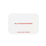 White card with red text reading "Will you be my partner?" and "We're not really strangers" in smaller text below.
