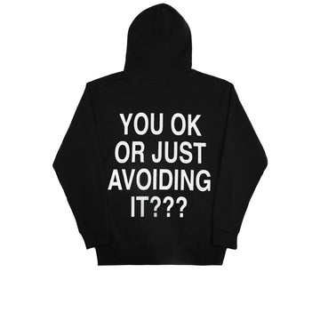 We're Not Really Strangers Mental Health Awareness Month. Back view of black You Ok Or Just Avoiding It Hoodie reading 