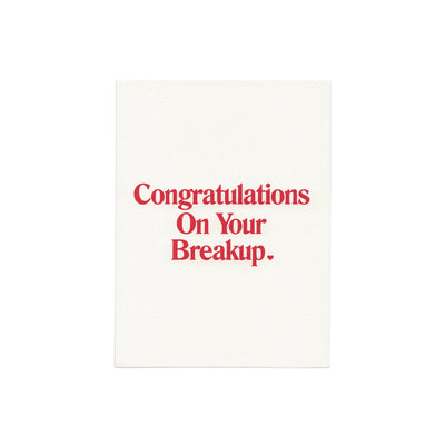 We're Not Really Strangers zoomed out front facing view of Congratulations on your breakup card flat lay.
