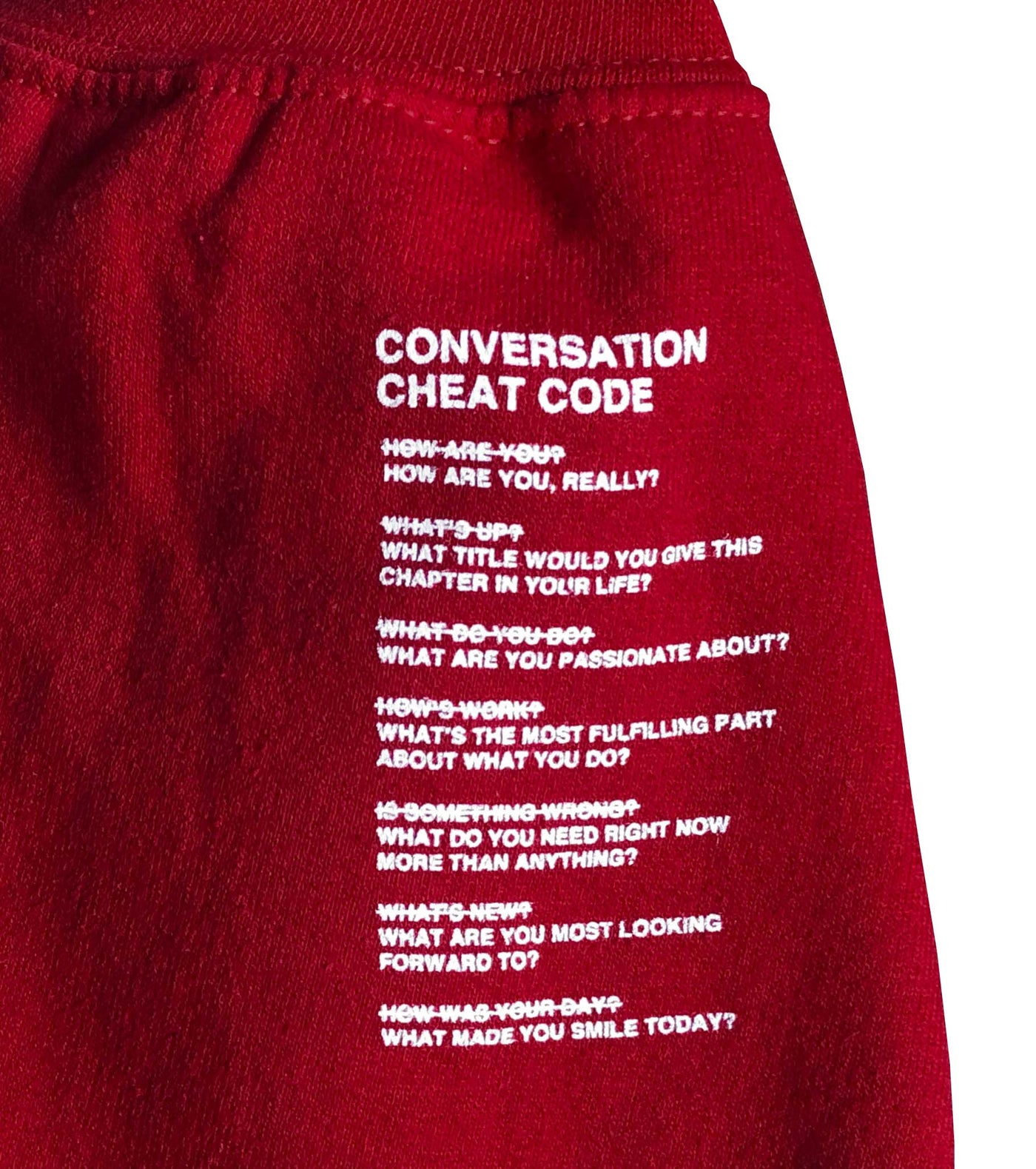 We're Not Really Strangers Red Cheat Code Crewneck laying flat zoomed in show sleeve detail