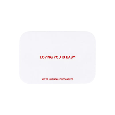 We're Not Really Strangers E-Gift Card. Front facing view of white card option reading "Loving you is easy" in red font.