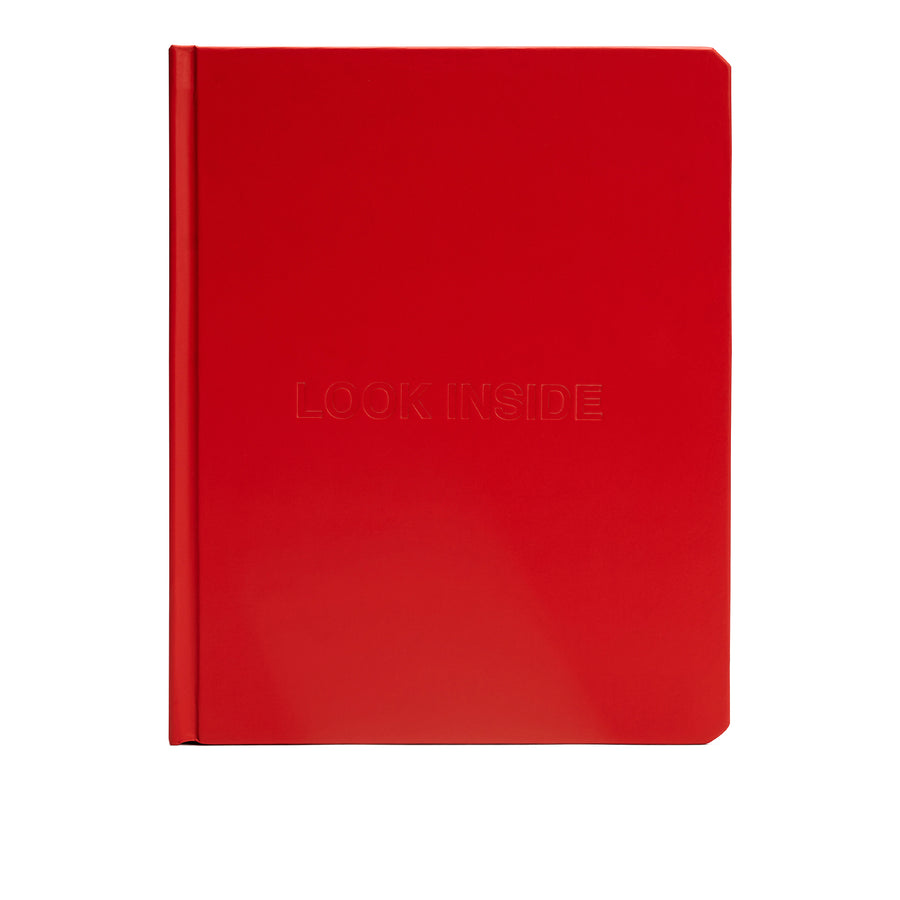 We're Not Really Strangers Journal. Front facing view of red journal reading 'look inside' embossed on cover.