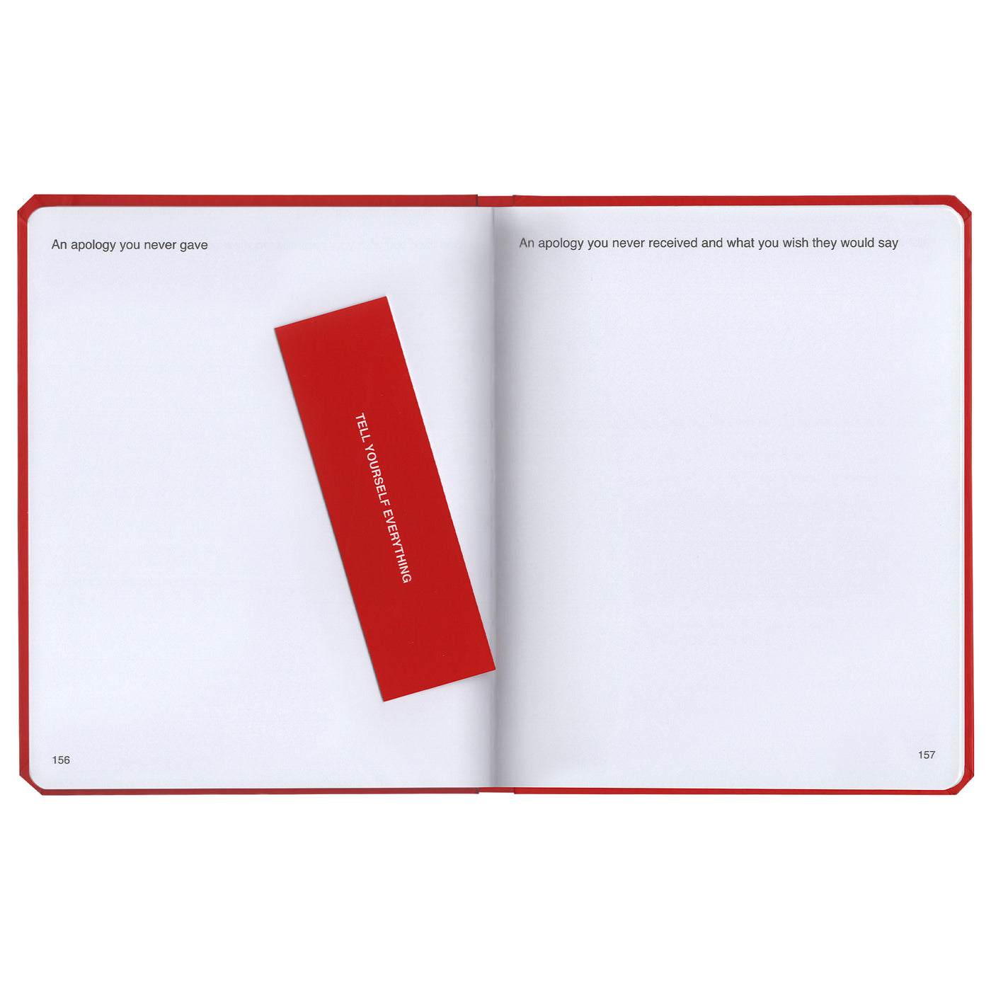 We're Not Really Strangers Journal. Front facing view of inside of journal blank pages showing two prompts reading "An apology you never gave" and "An apology you never received and what you wish they would say." With a red bookmark reading "Tell yourself everything" in white font.
