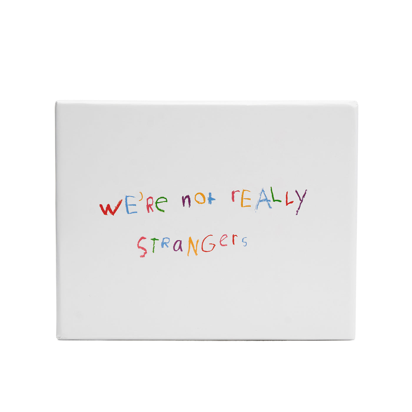 We're Not Really Strangers Kids Edition. Front facing view of white box reading 'We're Not Really Strangers' in rainbow crayon handwritten text.
