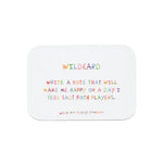 We're Not Really Strangers Kids Edition. Front facing view of game card reading "Wildcard - write a note that will make me happy on a day I feel sad! Both players."