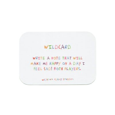 We're Not Really Strangers Kids Edition. Front facing view of game card reading "Wildcard - write a note that will make me happy on a day I feel sad! Both players."