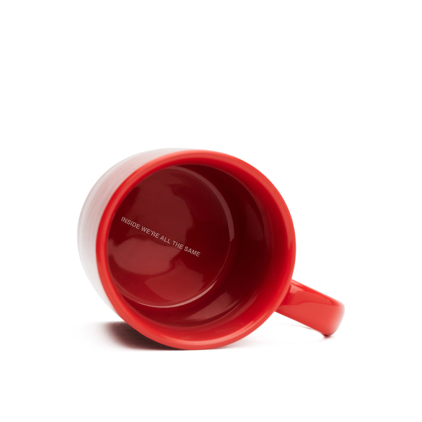 We're Not Really Strangers red mug showing the inside that says "inside we're all the same"