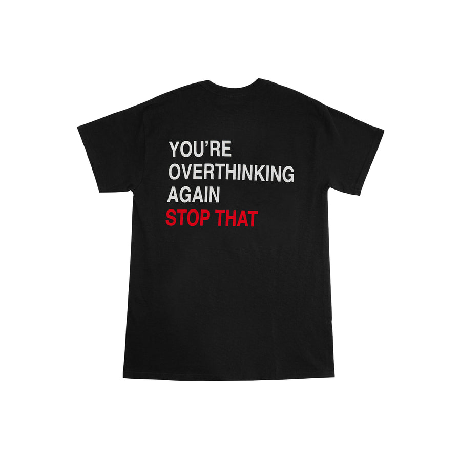 We're Not Really Strangers Mental Health Awareness Month. Back view of black You're Overthinking Again Tee with medium size font in white reading 