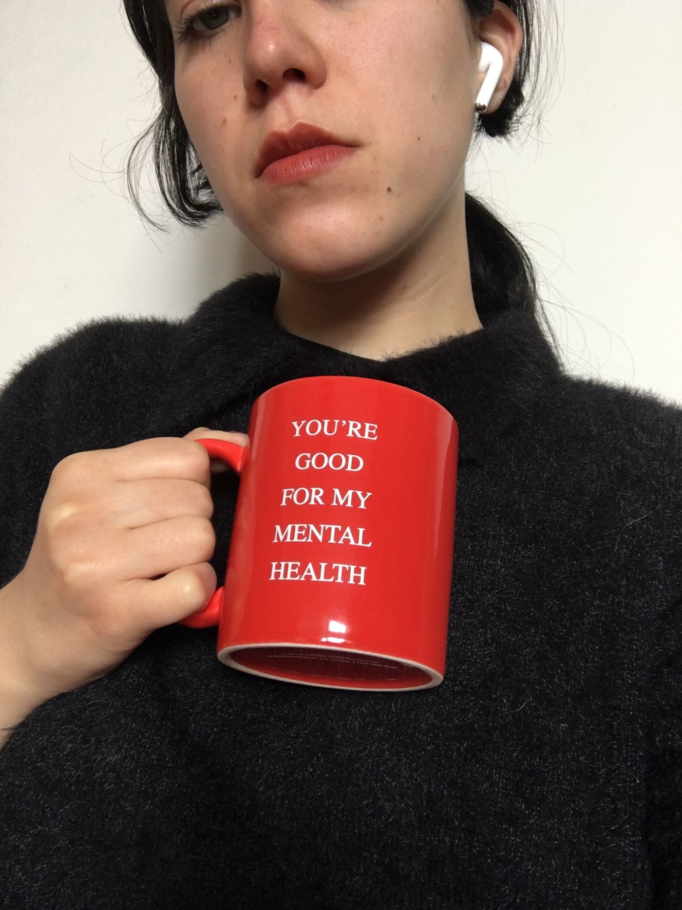 We're Not Really Strangers person holding Mental Health Mug